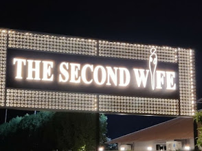 The Second Wife Restro and Cafe logo