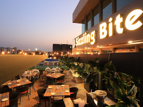 Sizzling Bite Restaurant logo