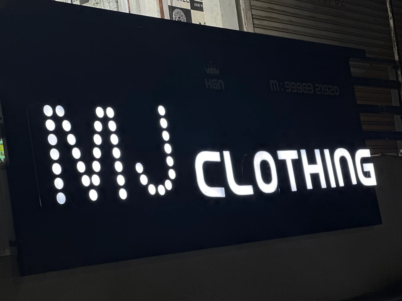 M J CLOTHING STORE logo