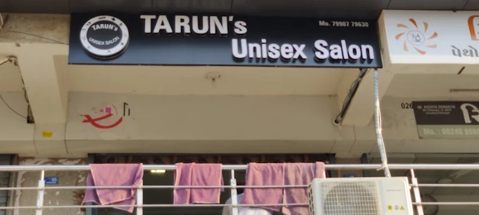 Tarun's unisex salon logo