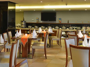 Mynt Restaurant - Vivanta Vadodara logo